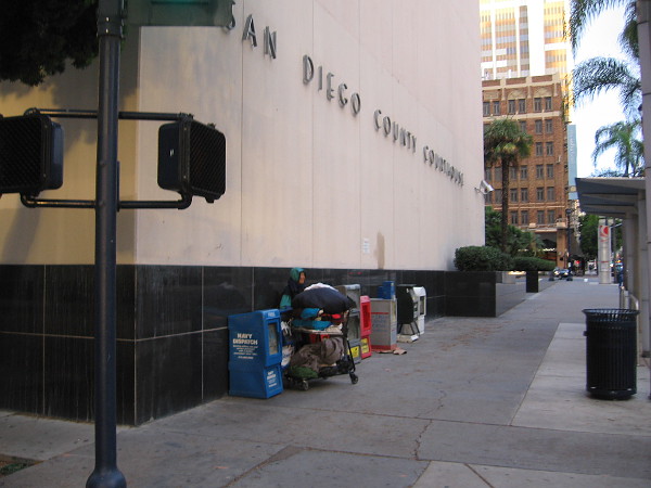 Someone camped against the San Diego County Courthouse. The number of homeless people downtown continues to grow.