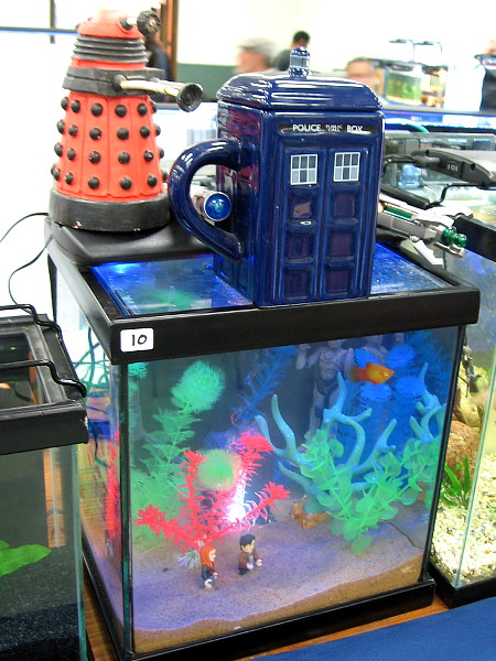 Dr. Who and a companion have traveled by TARDIS into the strange unearthly interior of this humorous aquarium.