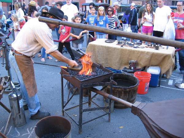 A blacksmith attracted a big crowd on Island Avenue in San Diego's Gaslamp Quarter.