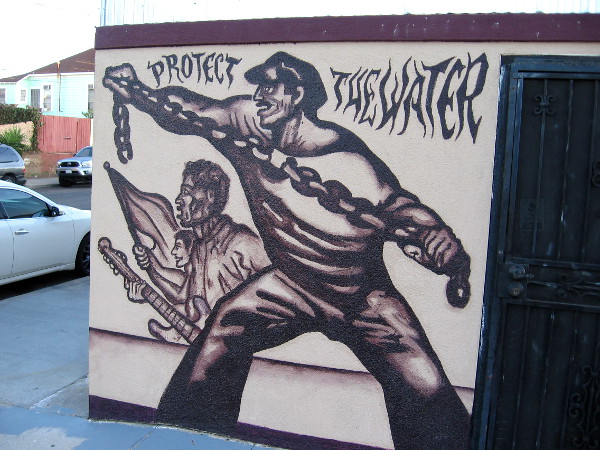 A few of the many images in the mural. Breaking a chain of bondage. Music and pride. Protect the water.