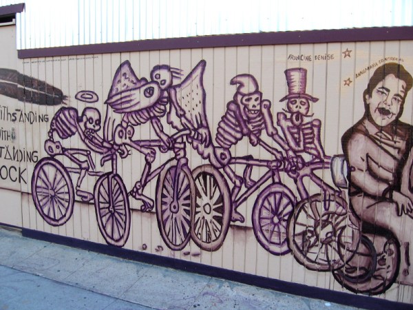 Skeletons on bicycles. Symbols, I believe, of past loved ones.