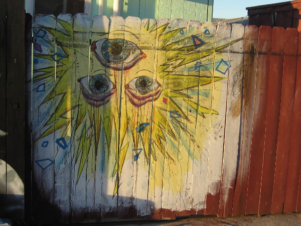 Three eyes in a blazing sun, which shines from The Nest Murals in Barrio Logan.