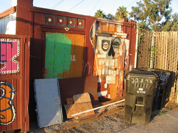 A face with odd geometric features in the Barrio Logan alley.