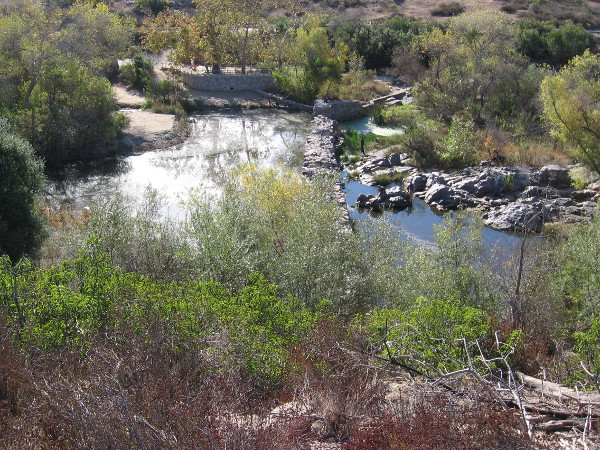 Photo of the Old Mission Dam from the north. The dam was built around 1813 and powered a water wheel that drove a grist mill. A tiled flume brought water to the mission, about five miles away.