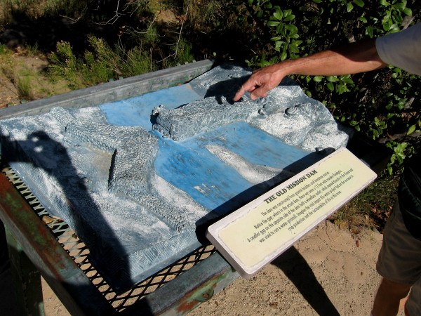 A cool 3-D model of the Old Mission Dam beside the trail. The dam was constructed from granite boulders and limestone mortar. At the gap there was a 12-foot wide floodgate.