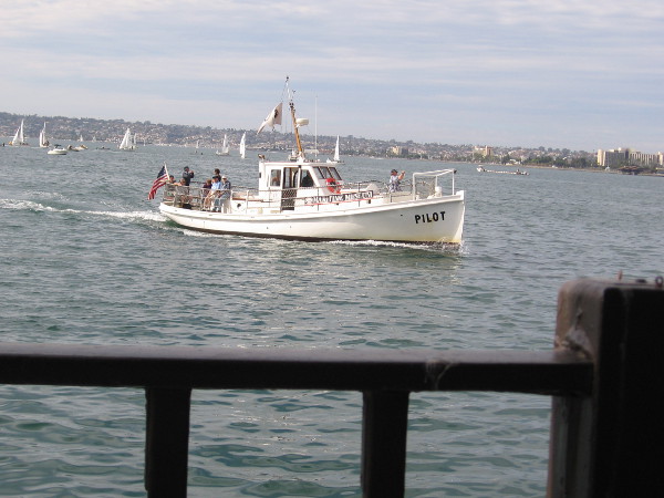 Here comes the Maritime Museum of San Diego's historic Pilot boat, out on a harbor tour. Those sailboats racing in the distance belong to the San Diego Yacht Club.