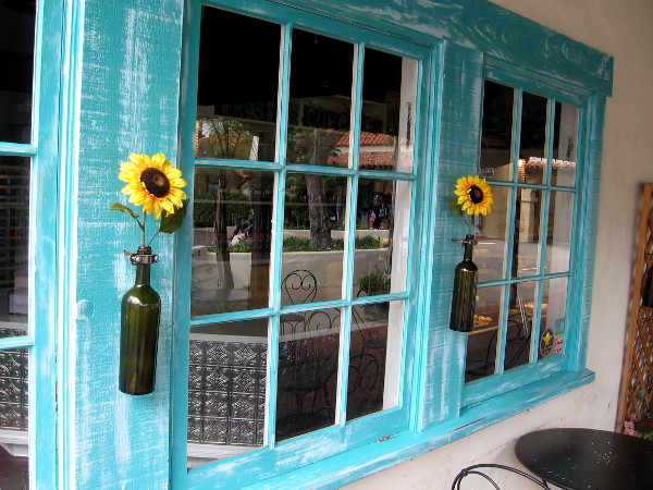 Sunflowers and blue window frames at Frost Me Gourmet Cupcakes in Seaport Village.