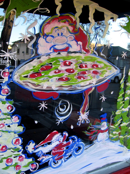 Santa Claus appeared this morning in Little Italy. He bought a yummy pizza at Landini's Pizzeria. I guess a good pizza is hard to come by at the North Pole.