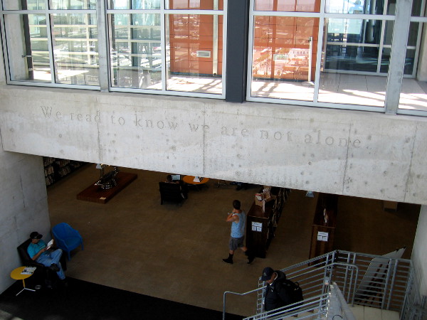 We read to know we are not alone. Wise words inscribed in the San Diego Central Library's large, friendly Reading Room.