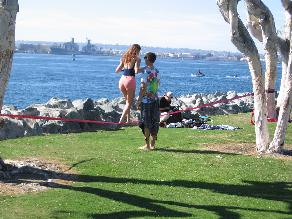 Two sweethearts enjoy slacklining at Embarcadero Marina Park South.