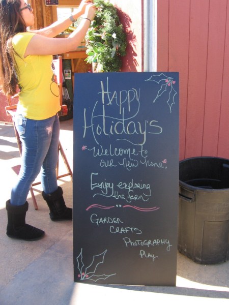 A wreath is hung on the barn inside SMARTS Farm to celebrate the holiday season. They've moved to a new location and are open to everyone in the community!