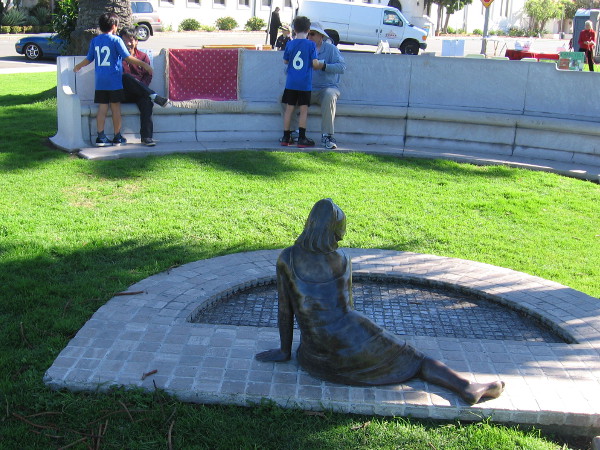 People enjoy a nearby bench at the La Jolla Recreation Center on a sunny December day.