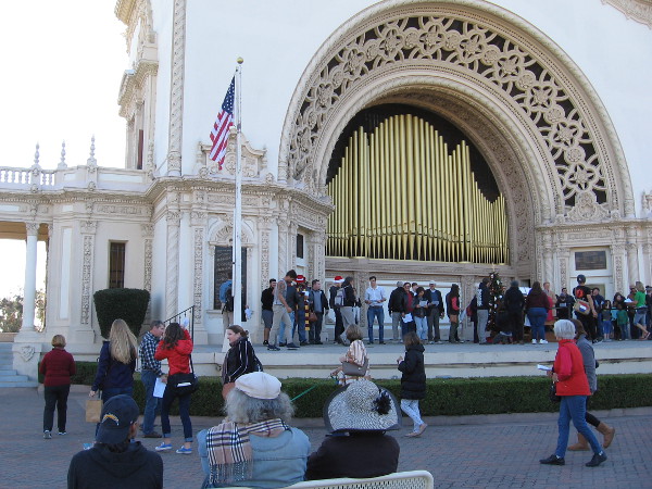 A crowd heads up onto the Spreckels Organ Pavilion stage. Anybody could join in the happy singing.