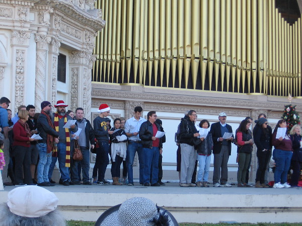 A heartwarming San Diego tradition in Balboa Park. Young and old, everyone and anyone--together people sing many beloved Christmas songs.