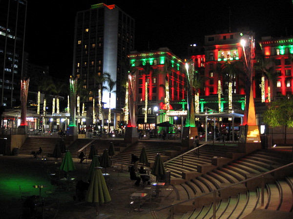 People have gathered for the evening in and around the Horton Plaza Park amphitheater. Downtown San Diego is lit beautifully for Christmas.