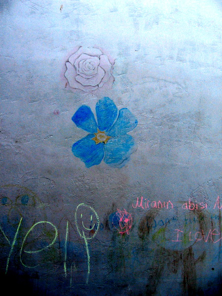 Chalk flowers on a playground's concrete wall, near The New Children's Museum in San Diego.