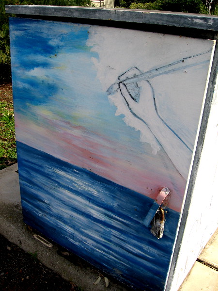 On the next side of this box we see a hand with brush, making beautiful art.