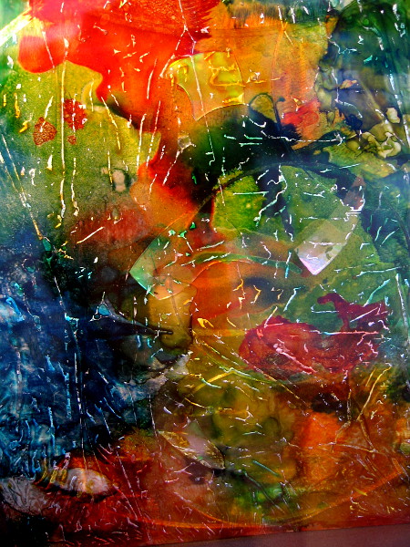 Colors and light change appearance in this holographic painting as the point of view shifts.