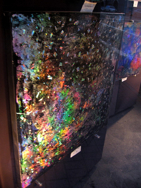 Several brilliant painting turn in the light on a carousel. One can see these at the now closed Gaslamp 15 movie theater on Fifth Avenue.