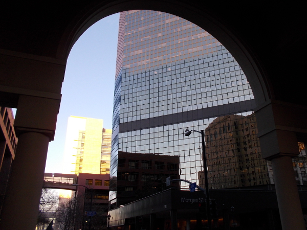 Peering at reflections on the AT&T building and beyond.