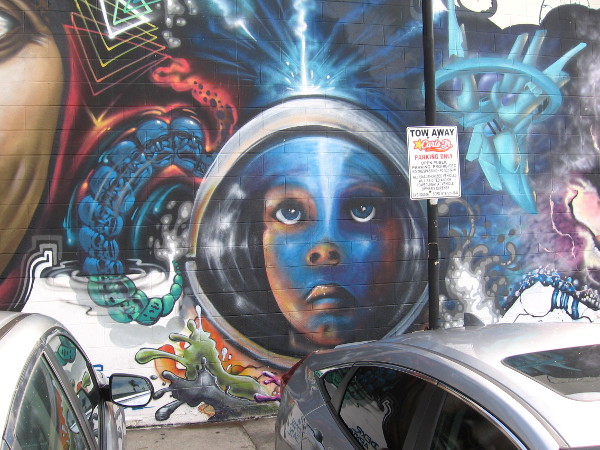 A face seems to gaze from another place behind a transparent window at the unspeakably vast and wonderful cosmos.