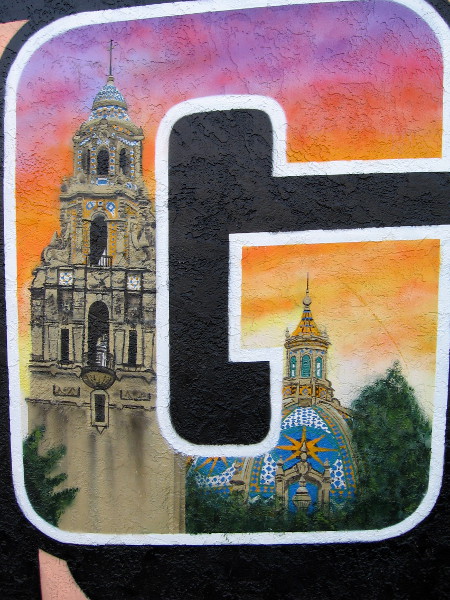 Balboa Park's iconic California Building and bell tower appear in the letter G in the same colorful North Park mural.