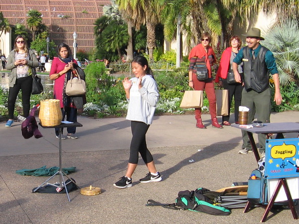 Young lady is about to get a surprise during a fun magic show in Balboa Park.
