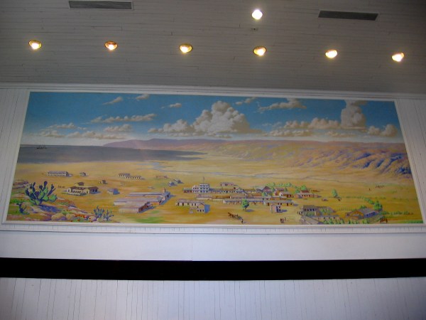 Colorful mural high on one wall shows a small town in the Old West. I believe I recognize many buildings in Old Town.