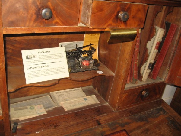 Nooks in this desk hold dip pens, receipts, letters and accounting ledgers.