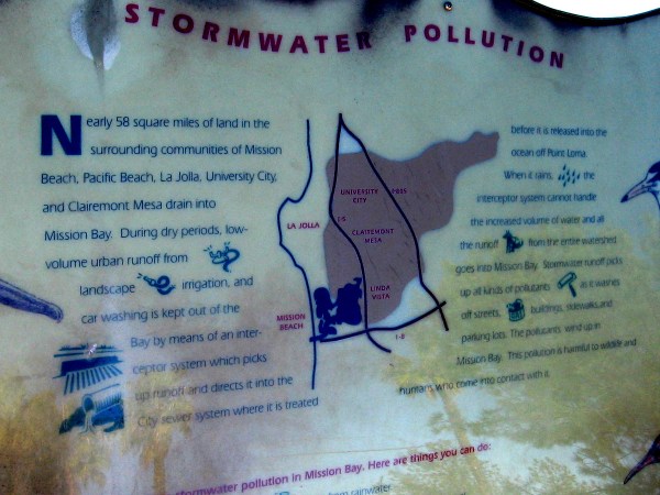 A sign by the river describes the problem of stormwater pollution. During rains, a good deal of runoff enters the estuary, carrying all sorts of pollutants and trash. (I had to really alter this photo so we could make out what the old sign says.)