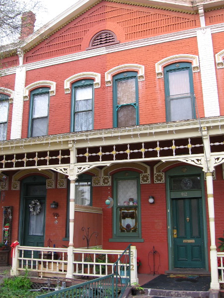 Photo of section of the handsome Brick Row in National City. The building now houses several specialty shops and the National City Historical Archive Room.