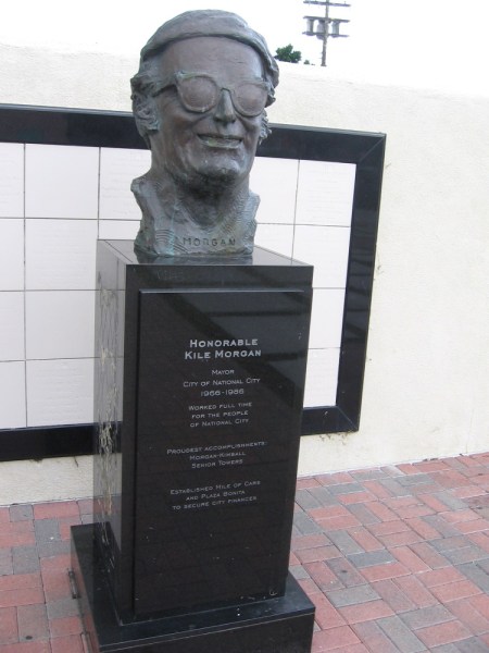 The bust of Honorable Kile Morgan, mayor of National City 1966-1986. He established the Mile of Cars and Plaza Bonita. Sculpture created by San Diego artist Richard Becker.