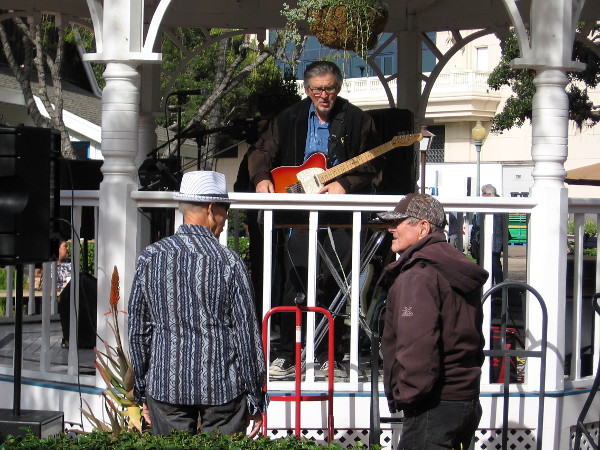 Member of the Cat-illacs band chats with folks at Seaport Village's East Plaza Gazebo.