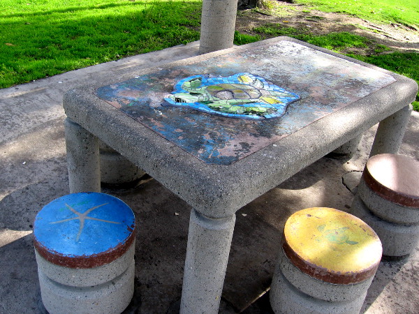 Colorful but weathered picnic table at Embarcadero Marina Park North is the remnant of public art from years ago.
