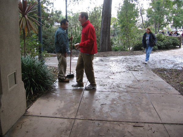 Cleaning up after the muddy, messy storm with a smile.