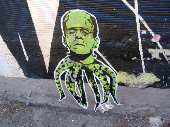 Frankenstein monster head with tentacles added to mural.