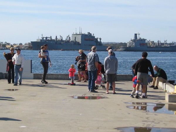 On New Year's Day lots of people are enjoying a walk by the water. I see two Navy oilers docked at North Island.