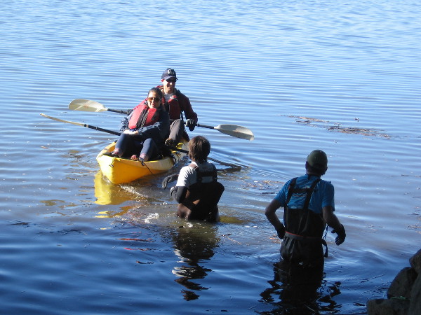 Kayakers launch into the San Diego River during a special event to clean the estuary.