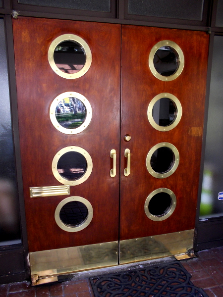 Nautical-looking door of the American Tunaboat Association on the Embarcadero near Tuna Harbor.