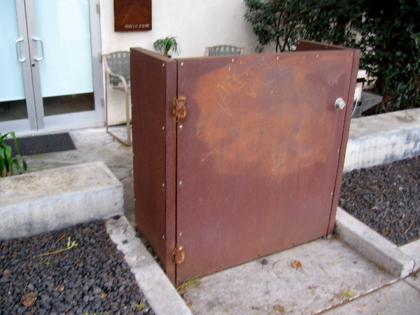 A very odd metal door in Little Italy. Seems to me it would quite easy to step around it!