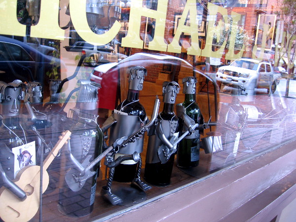 Wine bottles converted into interesting human characters in the window of Michael J Wolf Fine Arts in the Gaslamp.