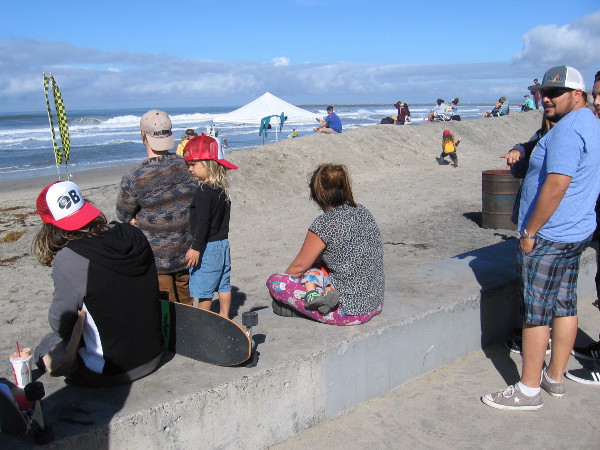 Hanging out on the sea wall and the sand berm. The latter protects the nearby street and businesses from high water during winter storms.