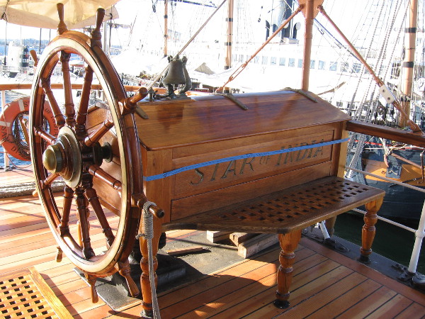 The helm's new varnish is still drying! In my dreams I command this amazing tall ship while standing at the wheel!