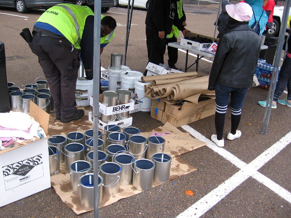 Getting the paint ready at the center of the parking lot where all the volunteers gathered in downtown's Core district.