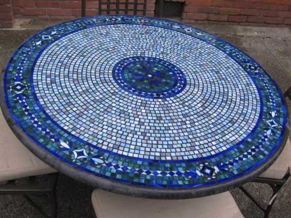 The mosaic tilework of an eatery's outdoor table in East Village.