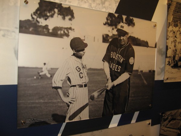 Babe Ruth poses with a bat during an exhibition tour at Balboa Stadium in 1927.