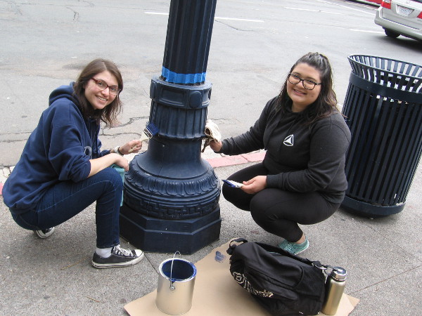 These nice volunteers were painting their third lamp post as I walked back through the area later in the day!