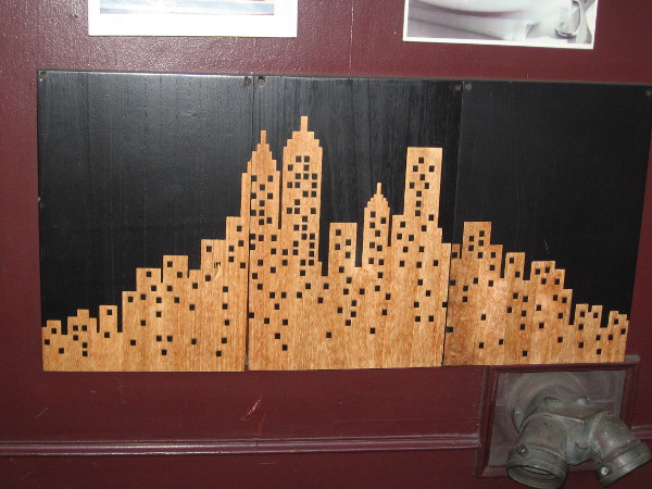 Depiction of a city on the wall of Sixth Avenue Bistro.