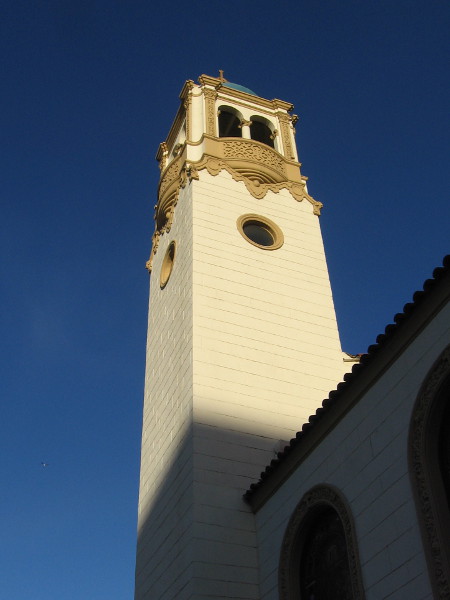 Sunlight on the high cathedral tower.