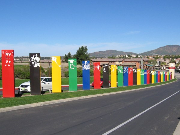 The colorful driveway into the 155-acre Elite Athlete Training Center complex includes graphics depicting many different Olympic sports.